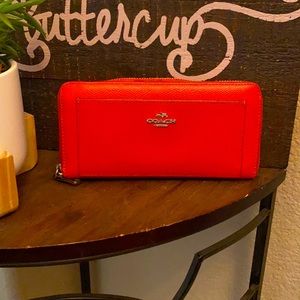 Bright orange Coach wallet